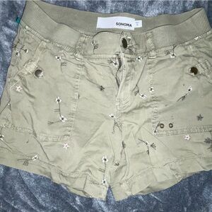 Two pairs of olive green shorts